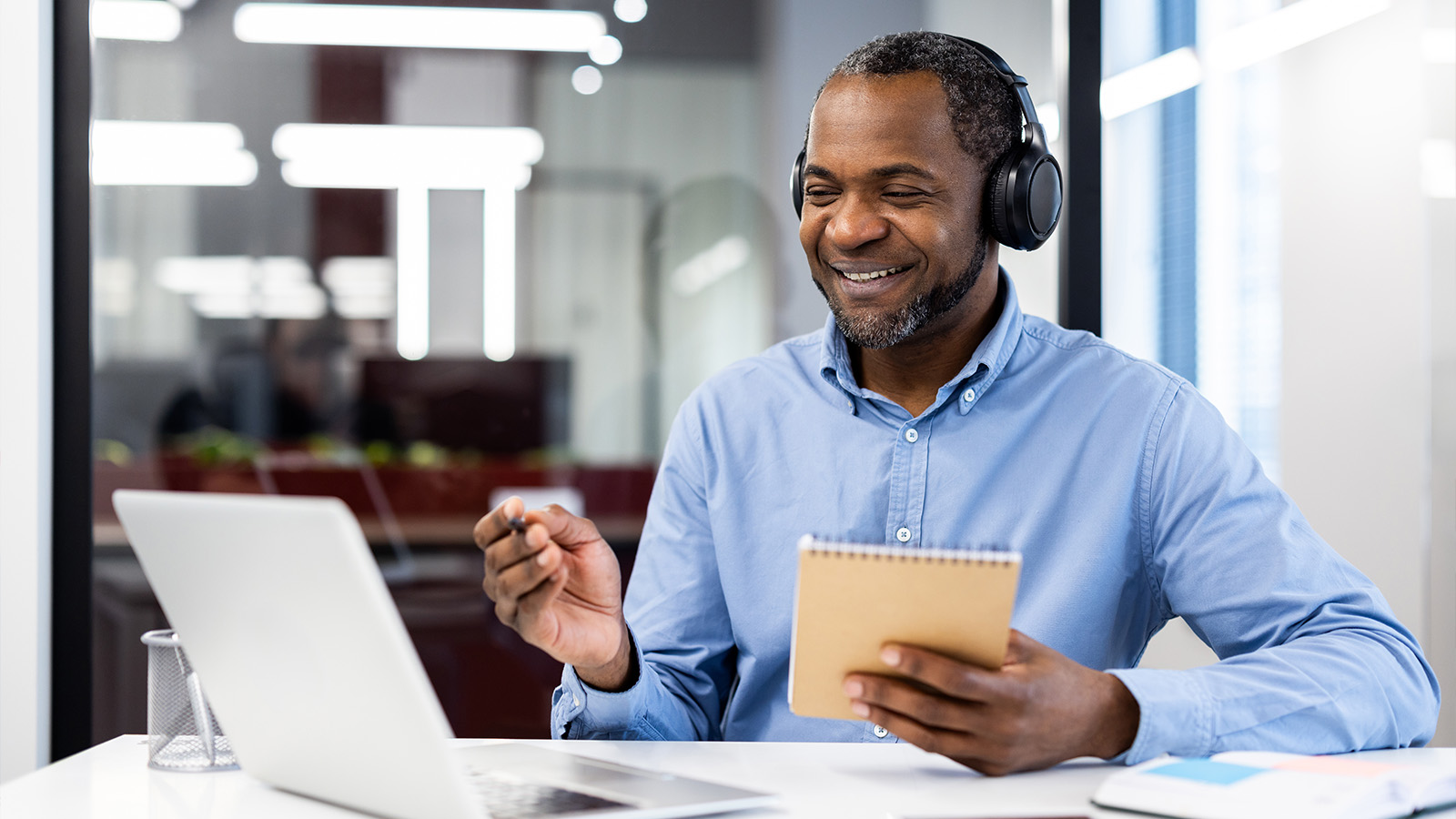 A man working on a professional development course at his computer.
